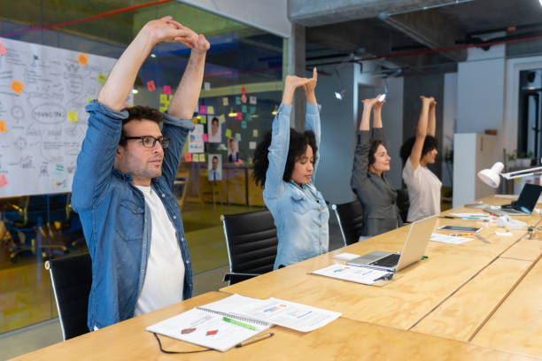Seated shoulder and upper back stretch at office desk